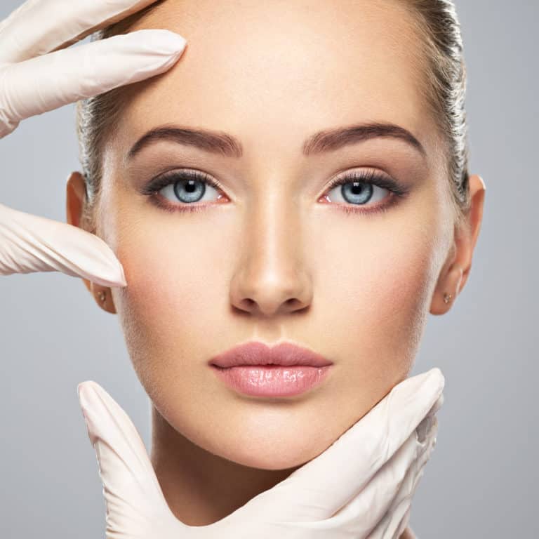 Cosmetic injectable treatment — a patient receiving a facial injection at a dermatology clinic